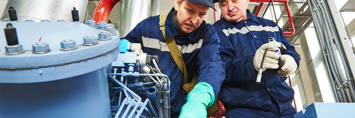 2 Maintenance Technicians Assessing an Air Compressor